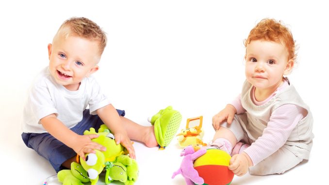 Babies play with toys
